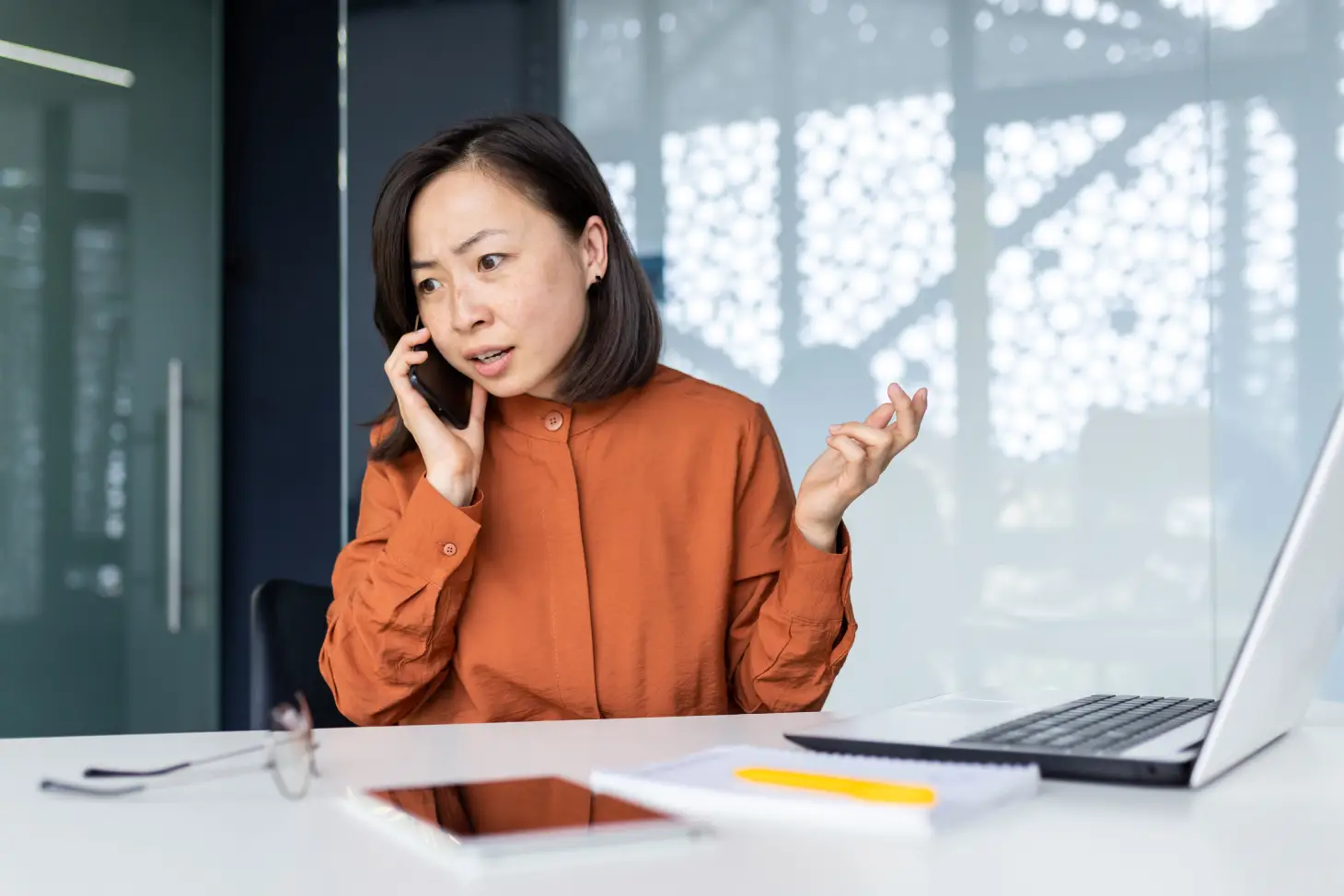 confused client calling their foreign exhibition booth fabrication company due to site problems